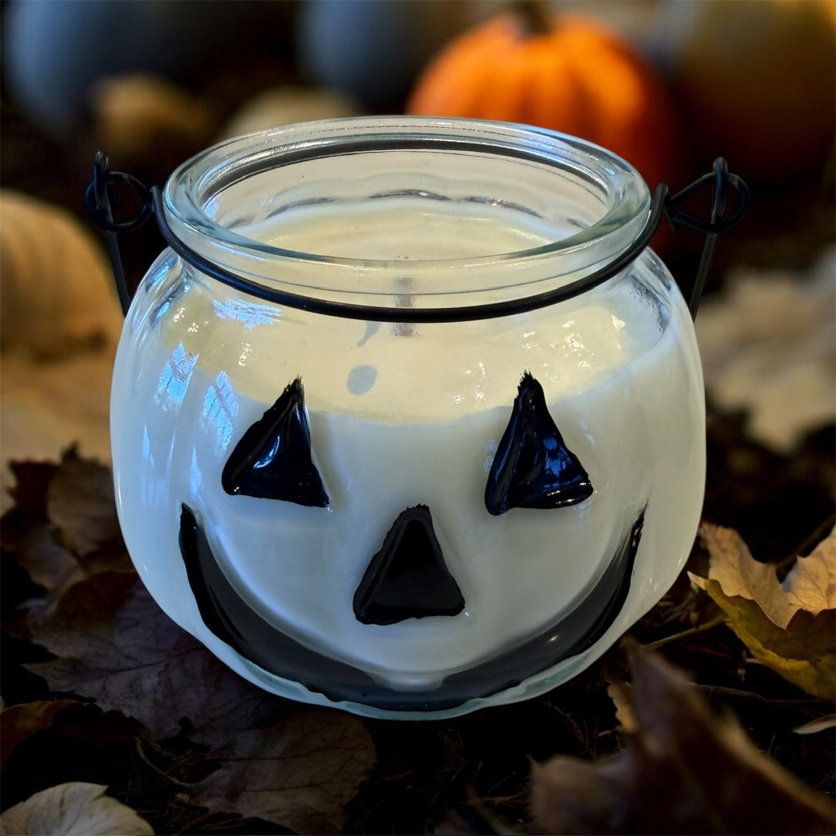 Jack-o-lantern pumpkin candle clear glass